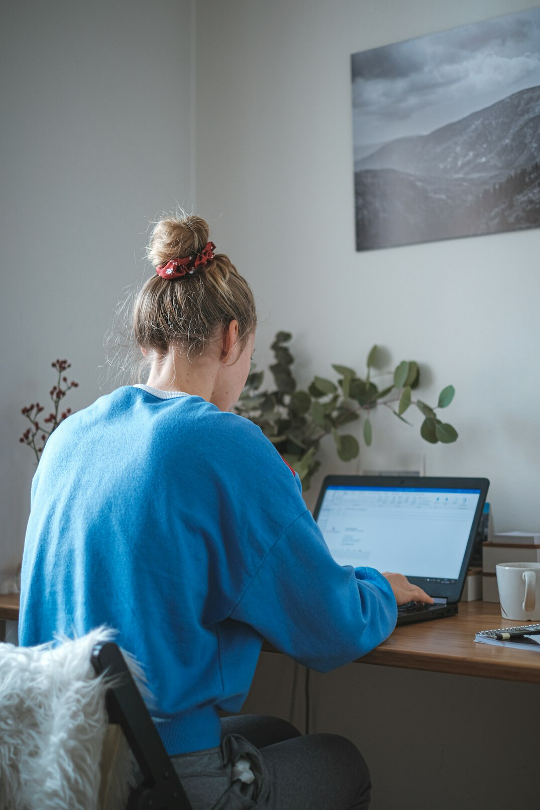 person working on laptop at home