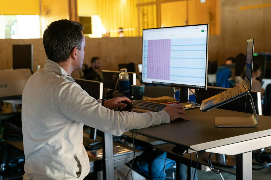 student studying programming at desk