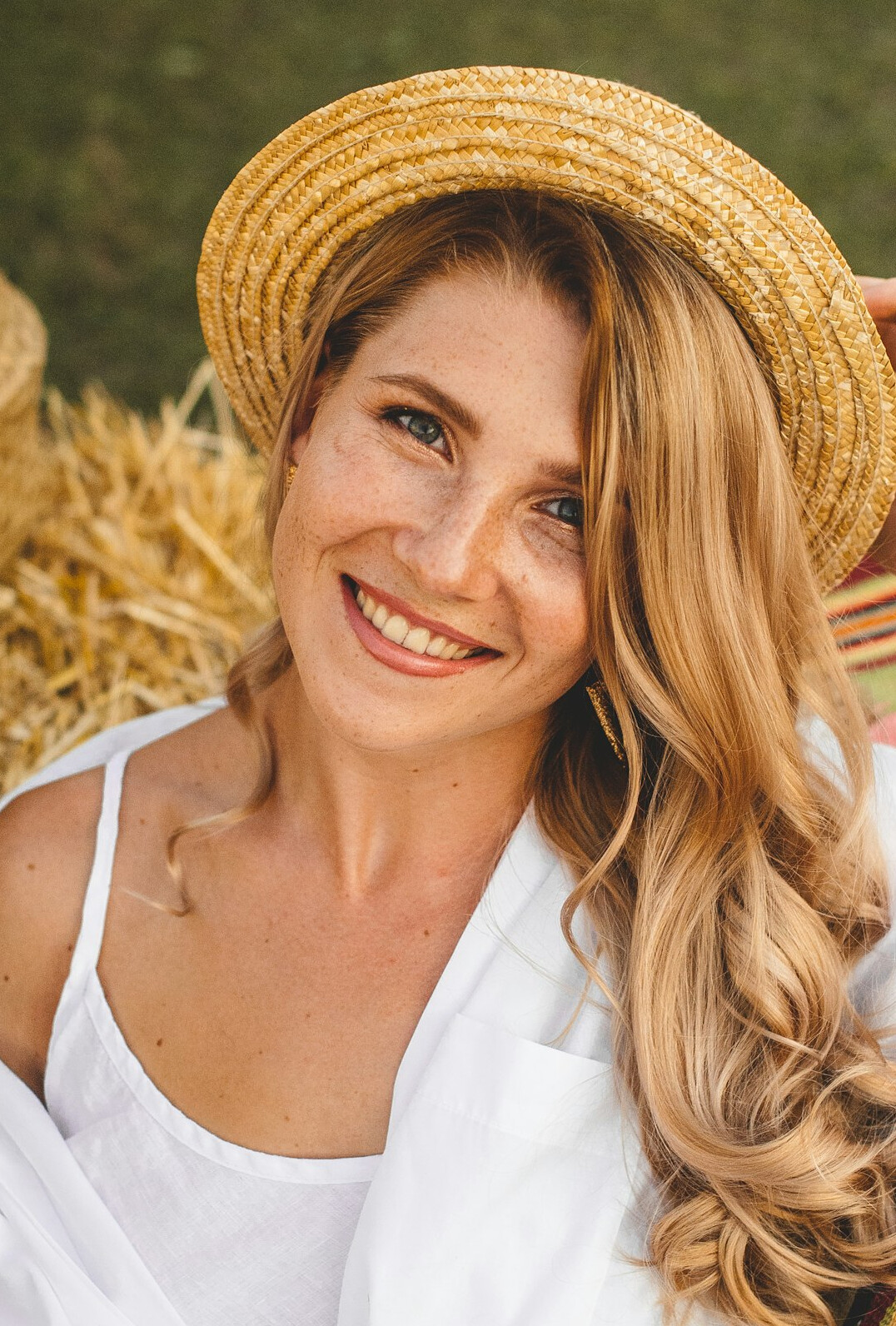 Portrait of a smiling woman with light brown hair