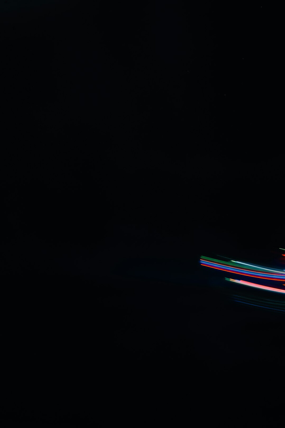 Monitor with colorful lines of programming code on a dark screen