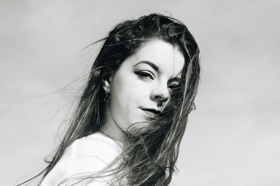 Portrait of a smiling young woman with long hair